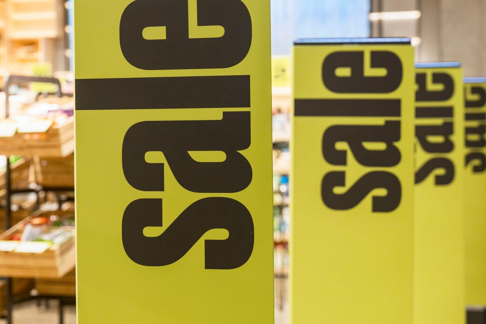Brisbane signage solutions showcasing bold POS sale signs designed to attract attention in retail environments.